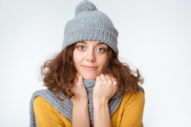Woman with scarf and hat looking at camera  - Foto, imagen