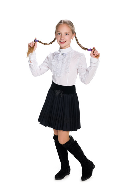 Гарненька школярка з кісками
 - Фото, зображення