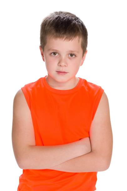 Thoughtful boy in an orange shirt - Фото, зображення