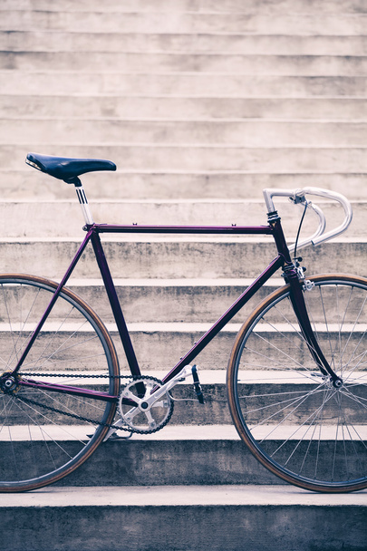 Road bicycle and concrete stairs, urban scene vintage style - Fotó, kép