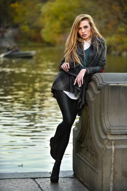 stylish woman posing in park - Fotó, kép