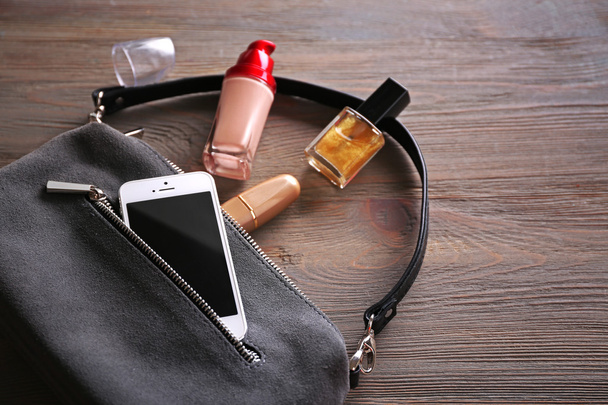 Ladies handbag on wooden background - Foto, Imagen