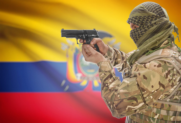 Male in muslim keffiyeh with gun in hand and national flag on background - Ecuador - Zdjęcie, obraz