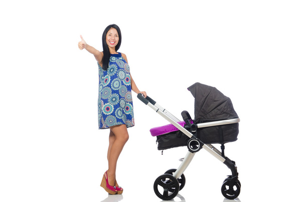 Happy mom with her baby in pram - Photo, Image