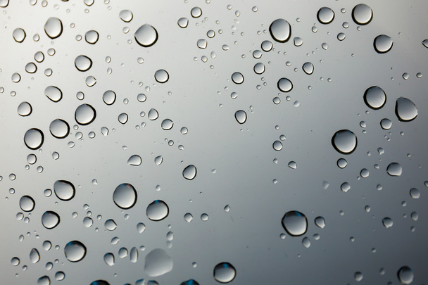 closeup water drop on glass mirror background. - Photo, Image
