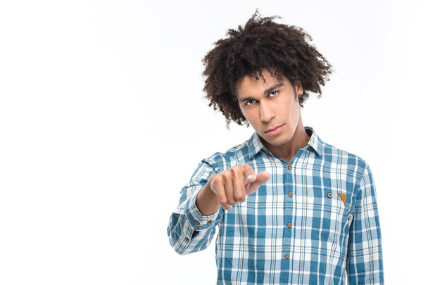 Afro american man with curly hair pointing finger at camera - Foto, Bild