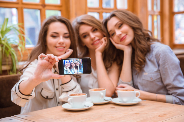 Women making selfie photo on smartphone in restaurant - Fotoğraf, Görsel