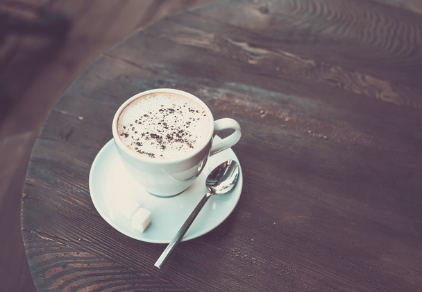 Cup of cappuccino on old - Фото, зображення