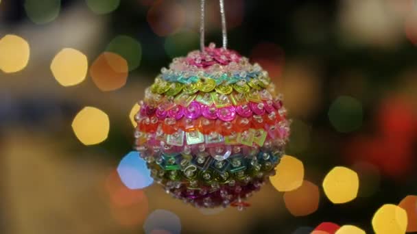 Christmas colorful ball shakes at background bokeh - Footage, Video