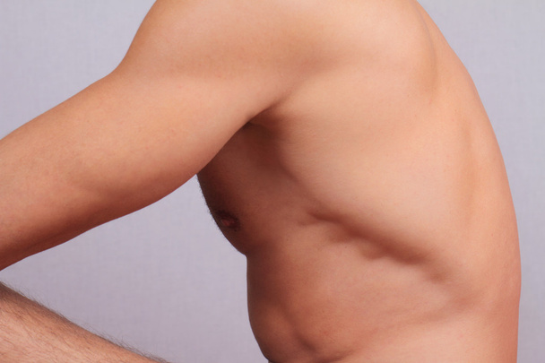 Male laser epilation. Attractive man torso hair removal. Close up on perfect male body, muscles - Foto, imagen