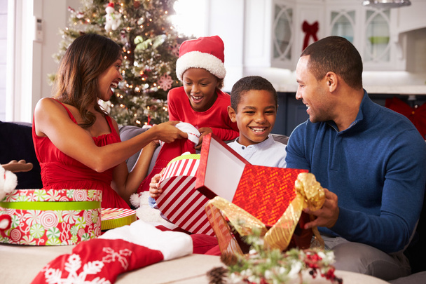 Family Opening Christmas Presents - Фото, изображение