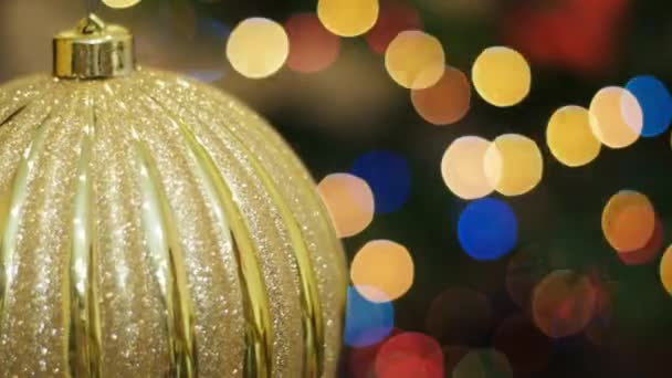 Big golden ball shakes at background bokeh - Footage, Video