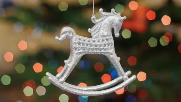 Christmas horse toy shakes at background bokeh - Footage, Video