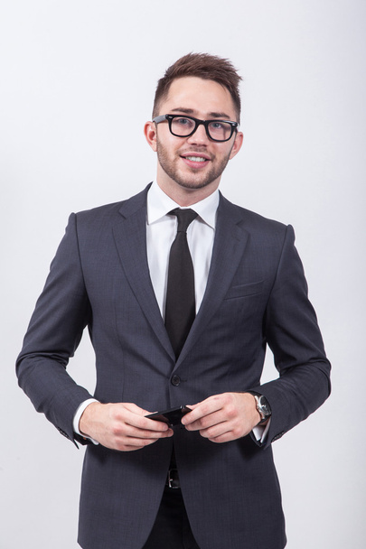Young successful and confident man on a white background simple  - Fotografie, Obrázek