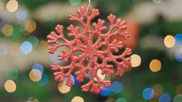 Christmas snow toy rotates at background bokeh - Footage, Video