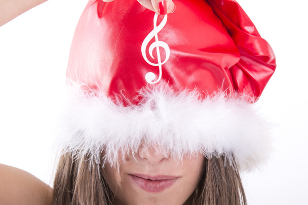 frohe Weihnachten Mädchen zeigt weiße musikalische Note - Foto, Bild