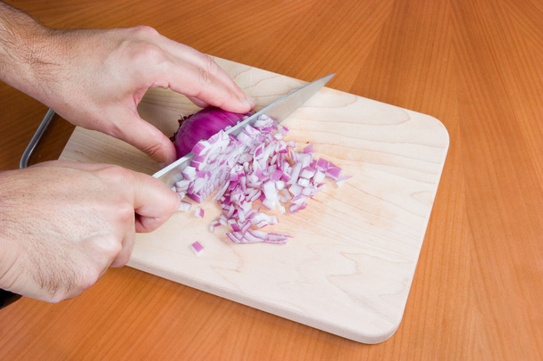 Chopping an onion on board - Fotografie, Obrázek