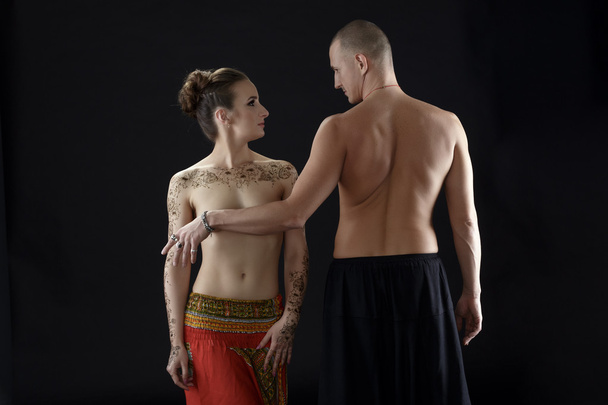 Nude yoga. Man covers womans breast with his hand - Foto, imagen