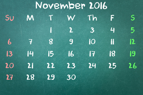 Groene krijtbord muur textuur met een woord kalender 2016 November - Foto, afbeelding