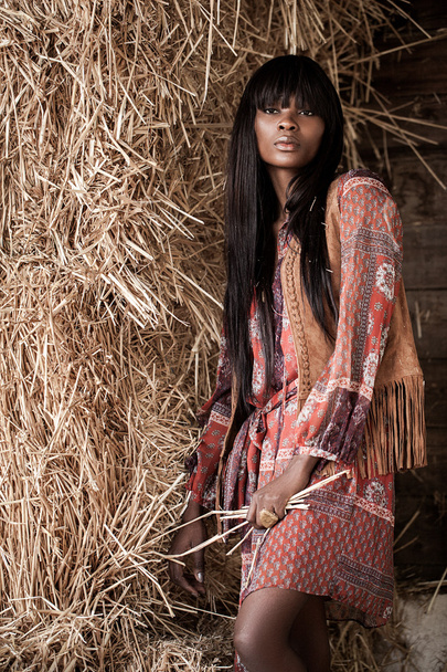 woman posing near the haystacks - Фото, зображення
