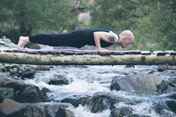 Man doing yoga in nature. - Fotoğraf, Görsel