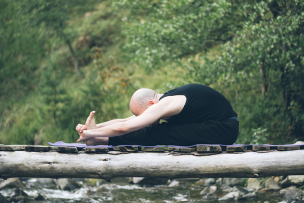 Man doing yoga in nature. - Fotografie, Obrázek