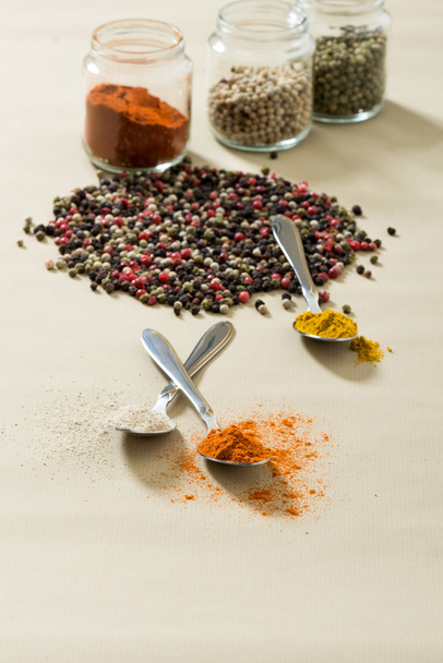 Different colorful spices on the wooden table. - Foto, Bild