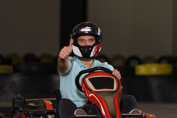 Man Showing Thumbs Up For Karting Race - 写真・画像