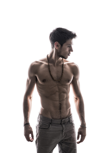 Handsome shirtless athletic young man on white - Photo, Image