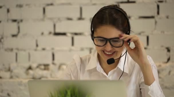 positive girl working in the call center - Felvétel, videó