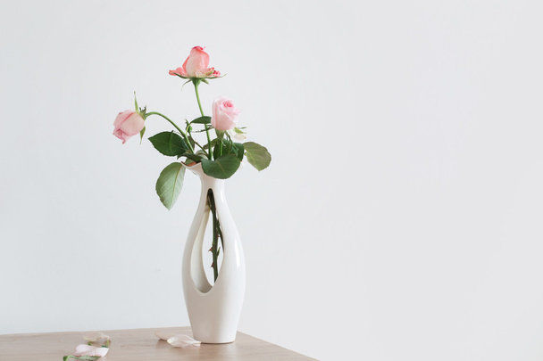 still life of pink rose in ceramic vase - Φωτογραφία, εικόνα