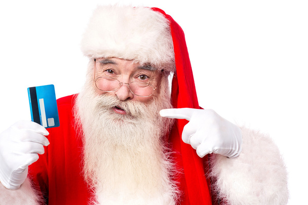 Santa claus showing credit card - Valokuva, kuva