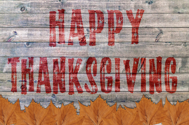 Happy Thanksgiving rood geschreven op houten plank achtergrond met veel blad - Foto, afbeelding