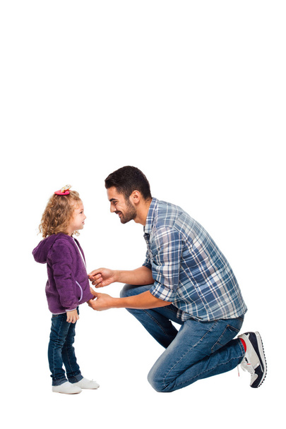 father arranging backpack of his daughter  - Photo, image