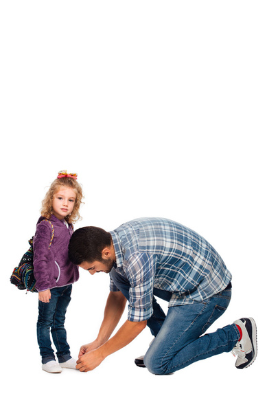 father arranging backpack of his daughter  - Foto, Bild