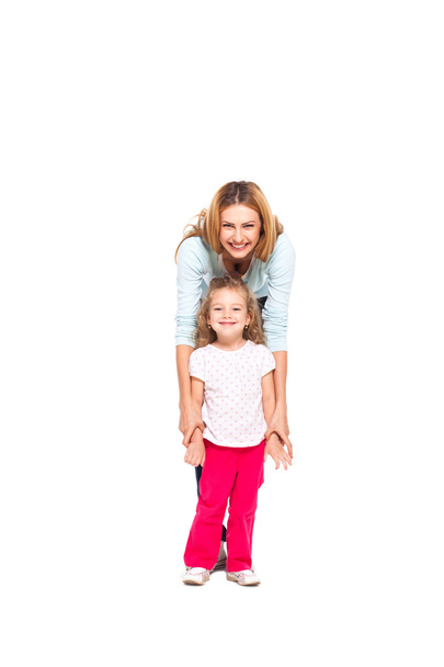 young mother and her little daughter isolated on white - Foto, afbeelding