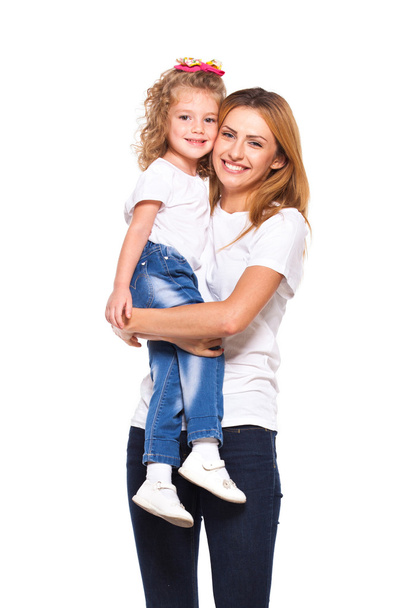 young mother and her little daughter isolated on white - Photo, Image