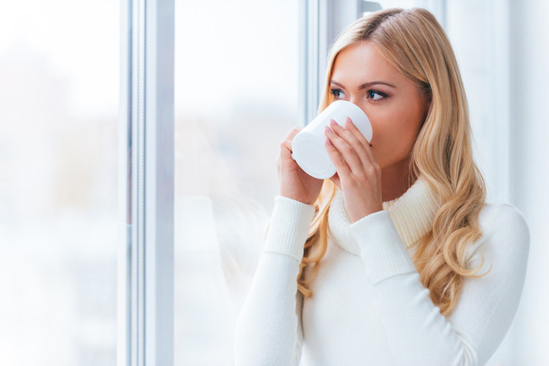 woman in white sweater drinking coffee - Photo, Image