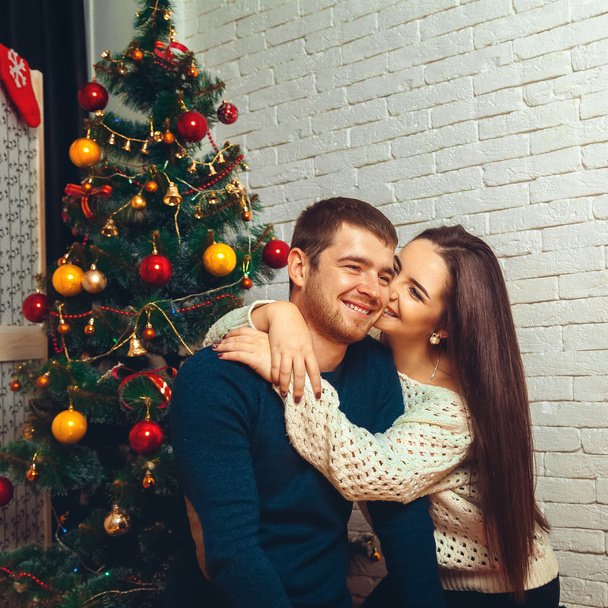 Happy couple flirting with each other New Year's Eve - Фото, зображення