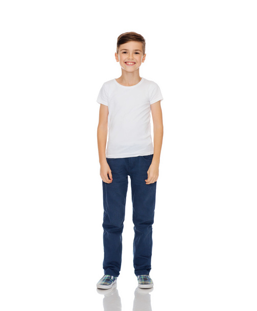 happy boy in white t-shirt and jeans - Фото, изображение