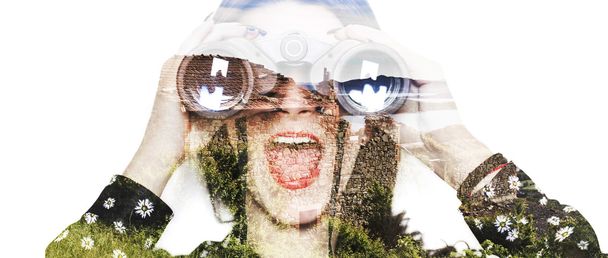 Double exposure of girl with binoculars and grass letterbox - Photo, image