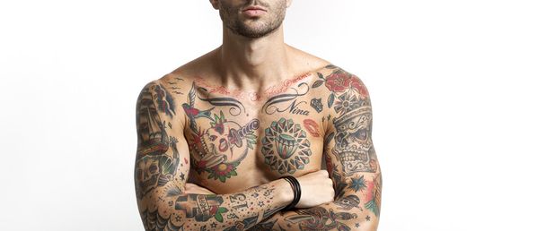 Handsome and sexy tattooed man portrait with crossed arms letter - Zdjęcie, obraz