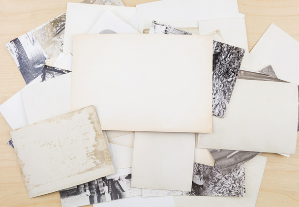 Stack of old photos on wooden surface. - Photo, Image