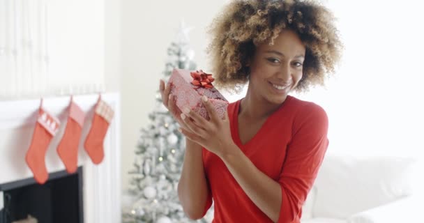 woman shaking Christmas gift - Felvétel, videó