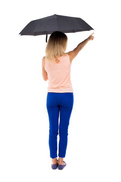 pointing  woman  under an umbrella - Foto, Imagem