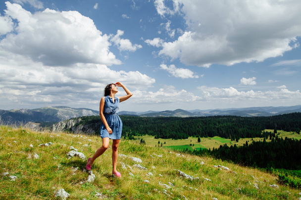  woman relax on hill with exciting landscape in mountains  - Photo, Image
