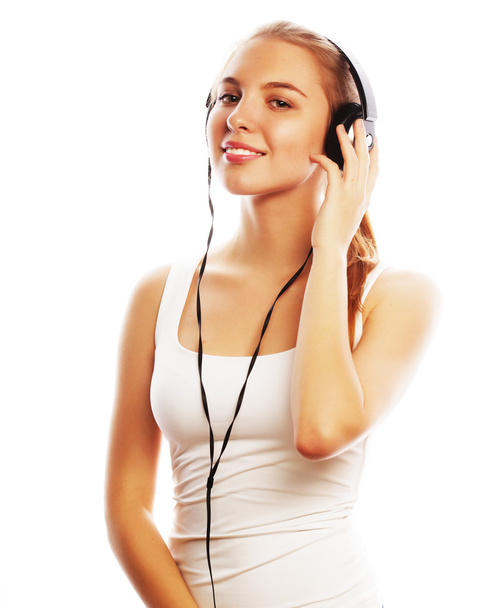 Woman with headphones listening music . Music teenager girl isol - Foto, afbeelding