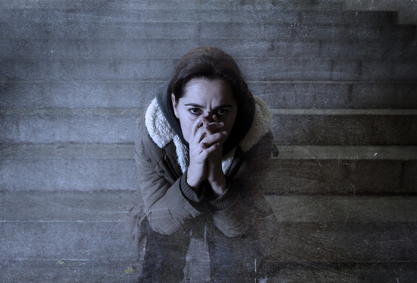 sad woman alone on street subway staircase suffering depression  - Photo, Image