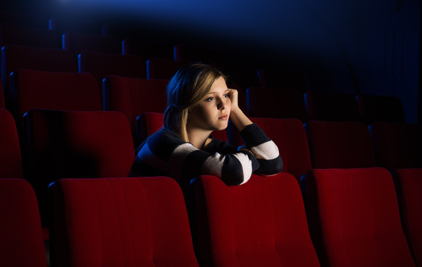 Young woman at the cinema - Фото, зображення