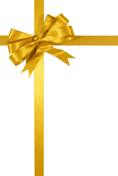 Altın hediye şerit yay üzerinde izole beyaz arka plan dikey - Fotoğraf, Görsel